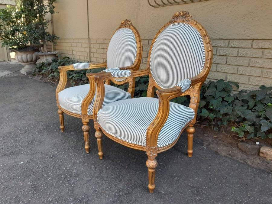 A 20TH Century French Style Pair Of Ornately Carved Giltwood Armchairs