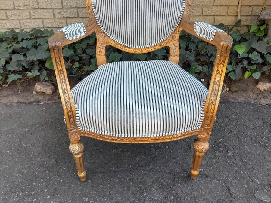 A 20TH Century French Style Pair Of Ornately Carved Giltwood Armchairs