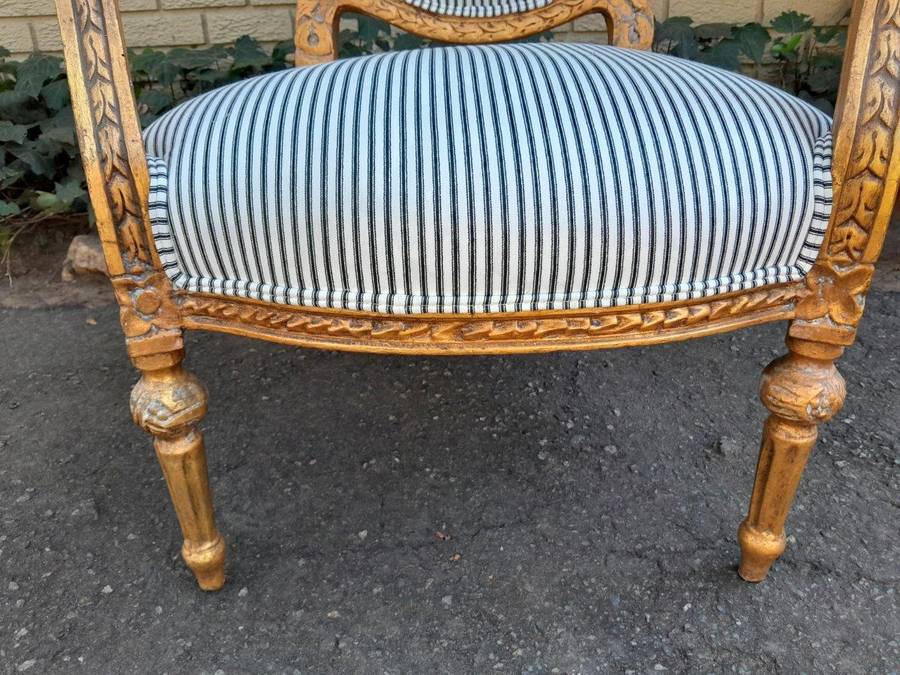 A 20TH Century French Style Pair Of Ornately Carved Giltwood Armchairs