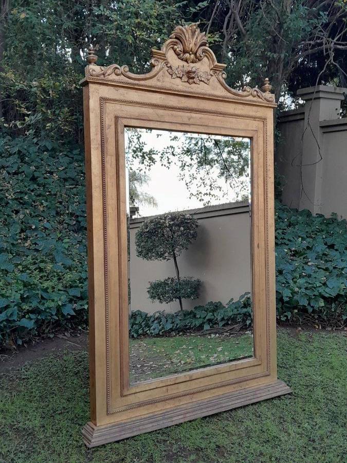 A Massive 20th Century French Style Ornately Carved and Gilded Bevelled Mirror