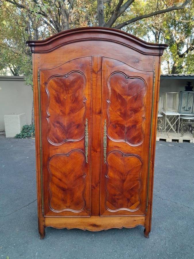 An Early 19th Century French Walnut and Cherrywood Port Armoire with Original Brass Fittings