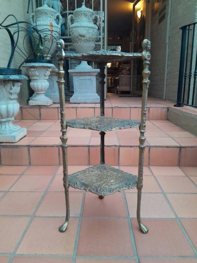 A 20th Century Chinoiserie Brass Stand On Paw Feet