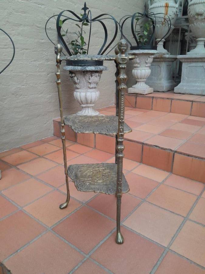 A 20th Century Chinoiserie Brass Stand On Paw Feet
