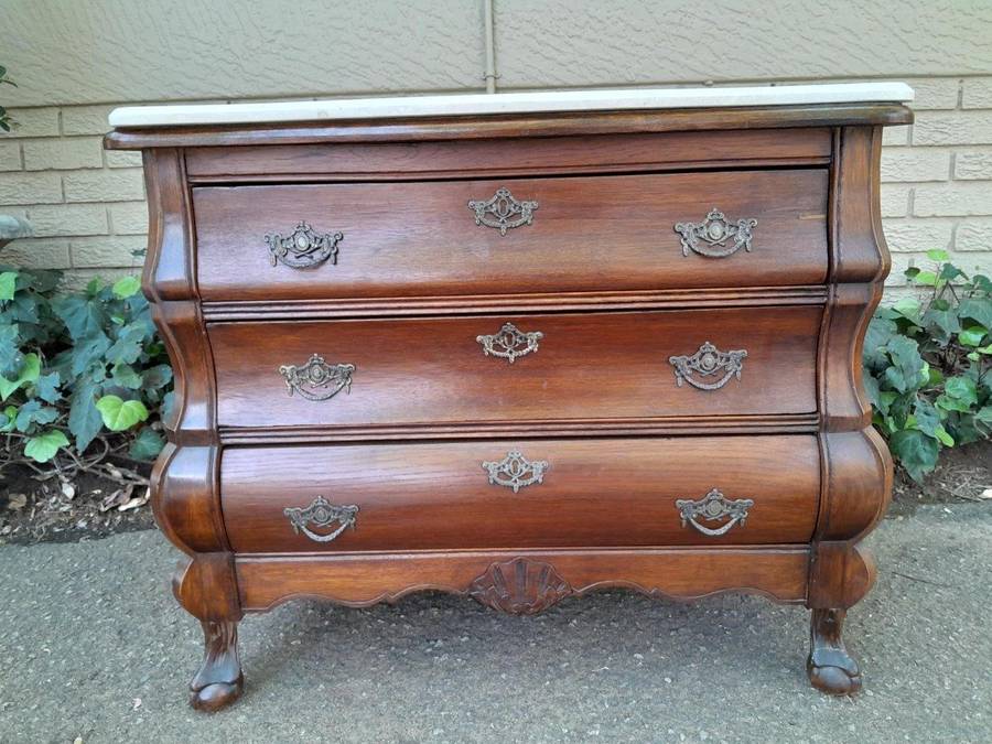 A 19th Century French Provincial Louis XVI-style Oakwood Bombe Chest of Drawers with Galala Cream...