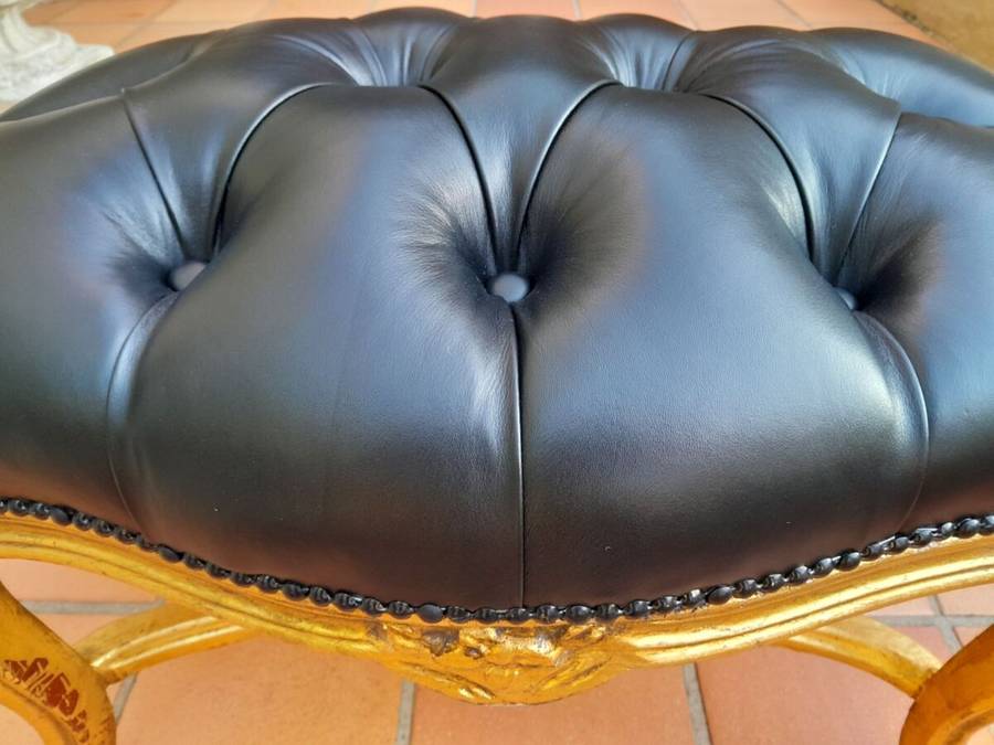 A French Style Giltwood Ottoman / Tuffet / Stool Upholstered in Deep Buttoned Leather