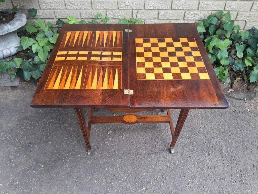 An Antique Edwardian Rosewood And Inlaid Chess / Games Table on Castors