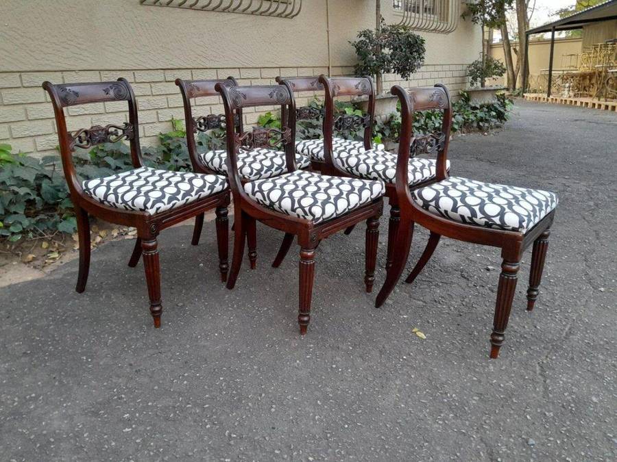 An Antique Regency Carved Rosewood Set Of Chairs With Rattan Seats And Upholstered Designer Fabri...