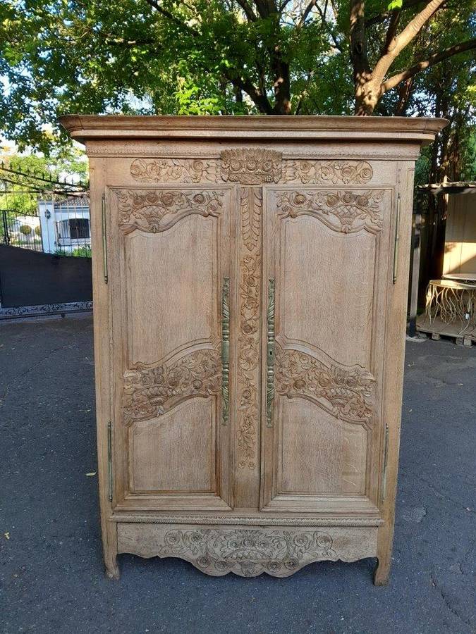 A 19th Century French Carved Oak Armoire With Drawers And Shelves