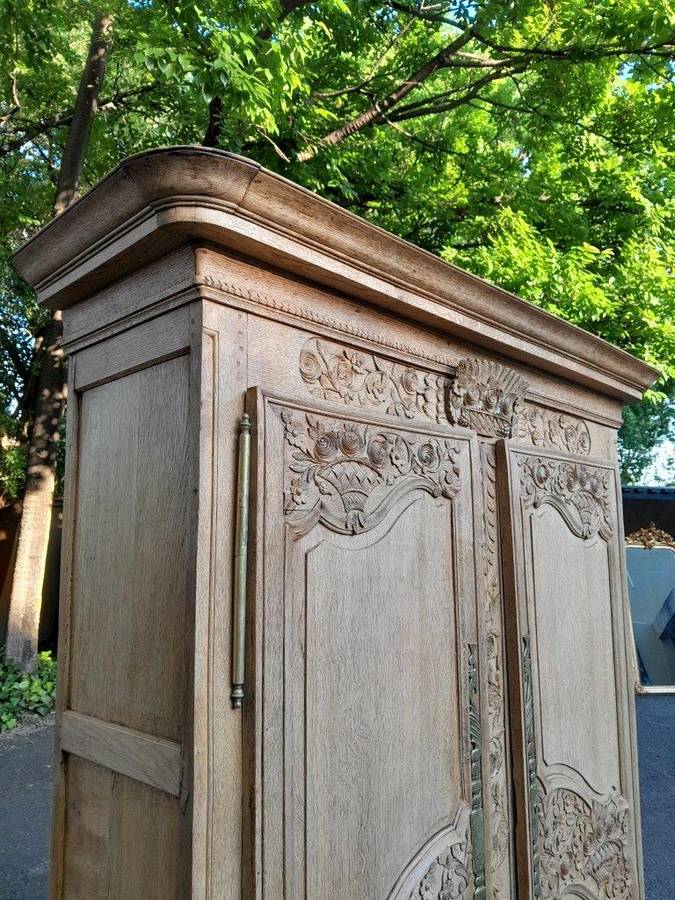 A 19th Century French Carved Oak Armoire With Drawers And Shelves