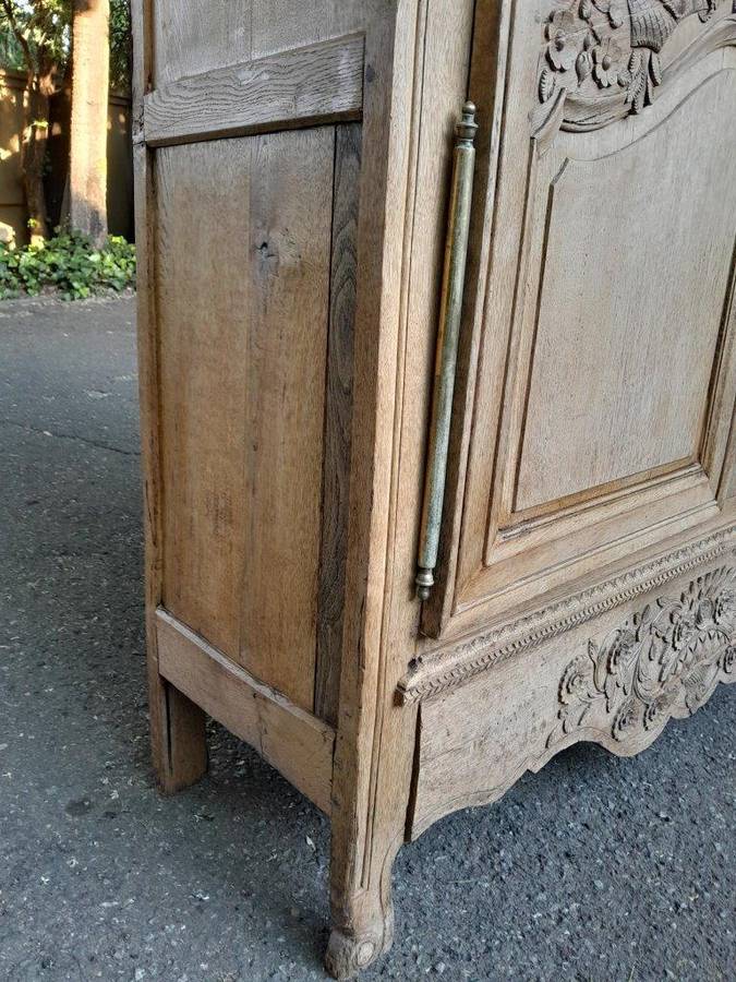 A 19th Century French Carved Oak Armoire With Drawers And Shelves