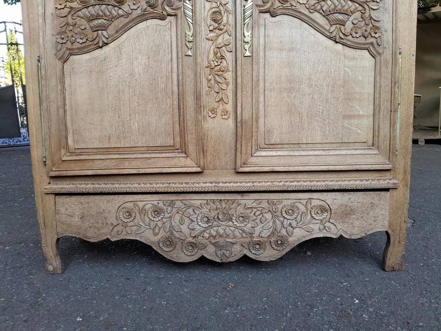 A 19th Century French Carved Oak Armoire With Drawers And Shelves