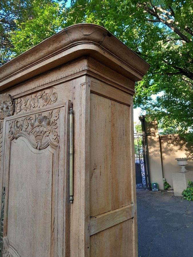 A 19th Century French Carved Oak Armoire With Drawers And Shelves