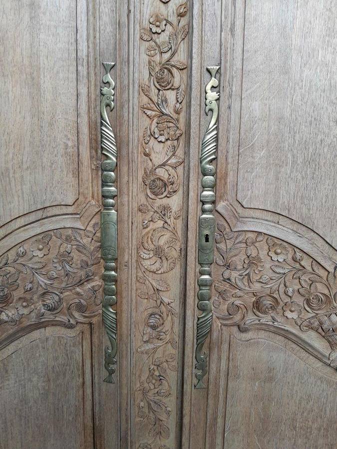A 19th Century French Carved Oak Armoire With Drawers And Shelves
