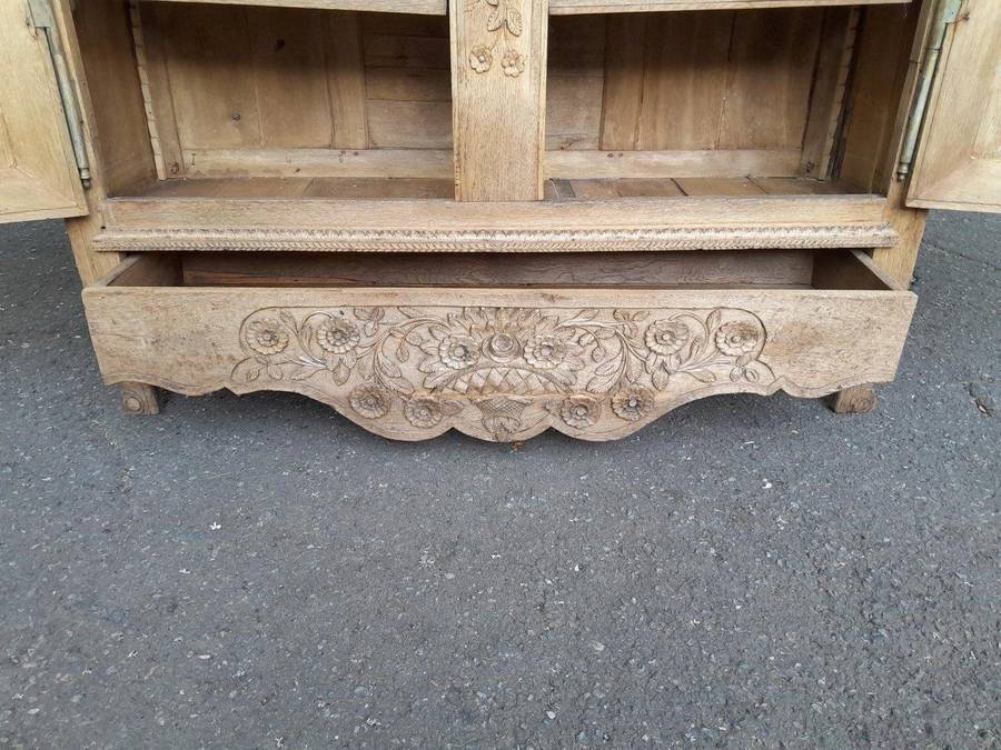 A 19th Century French Carved Oak Armoire With Drawers And Shelves