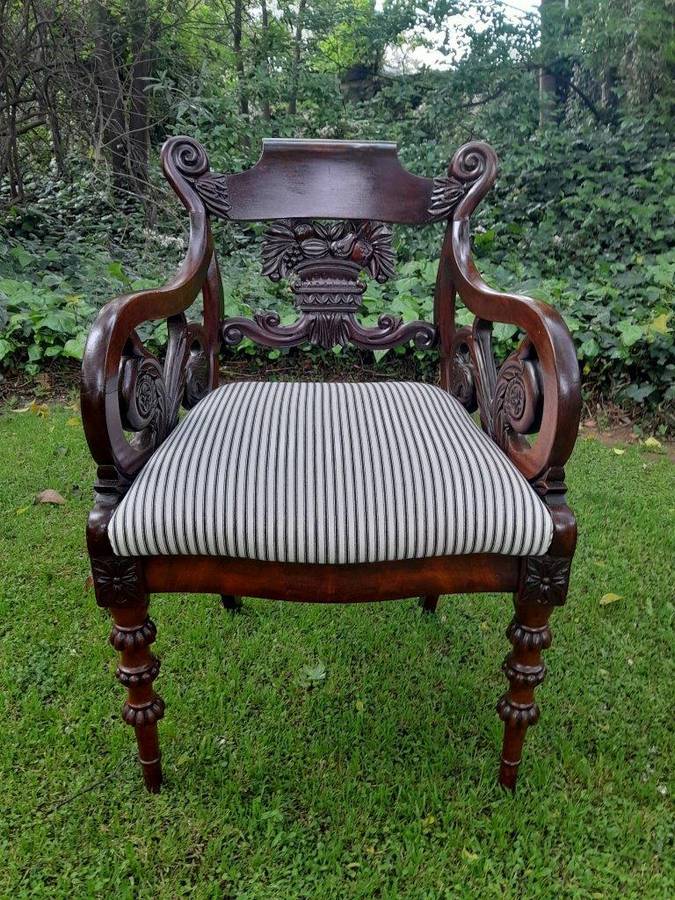 An Antique Mahogany Heavily Carved Armchair Upholstered Nd