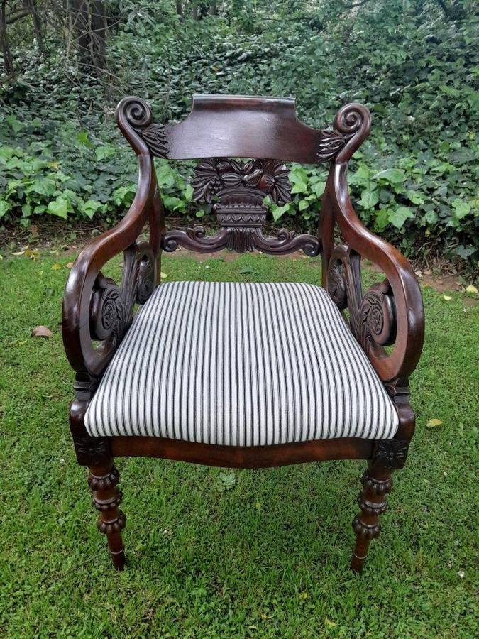 An Antique Mahogany Heavily Carved Armchair Upholstered Nd