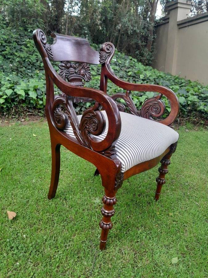 An Antique Mahogany Heavily Carved Armchair Upholstered Nd