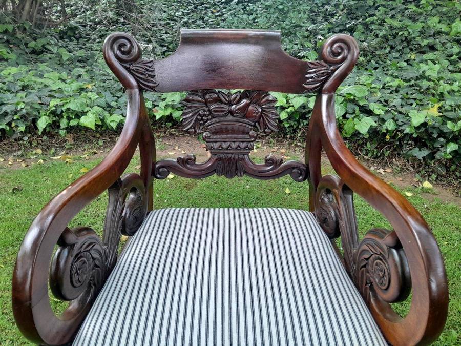 An Antique Mahogany Heavily Carved Armchair Upholstered Nd