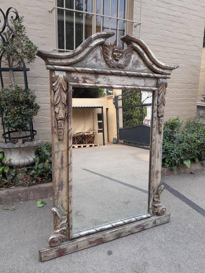 A French Style Heavily Carved And Hand Gilded With Gold Leaf Mirror