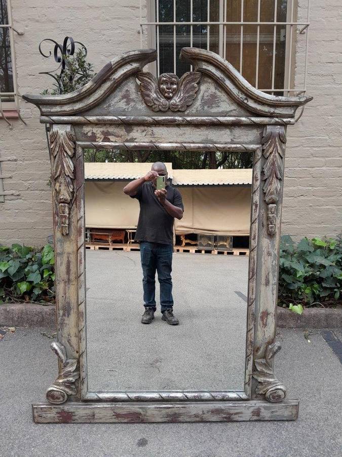 A French Style Heavily Carved And Hand Gilded With Gold Leaf Mirror