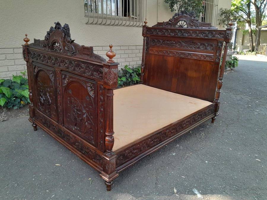 An Antique French Brittany Heavily Carved Oak Bed