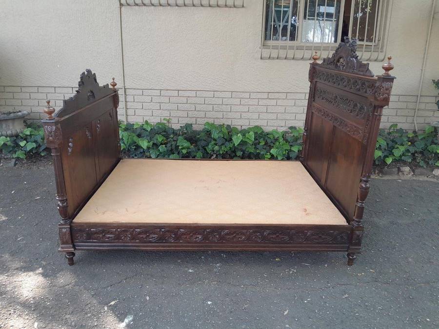 An Antique French Brittany Heavily Carved Oak Bed