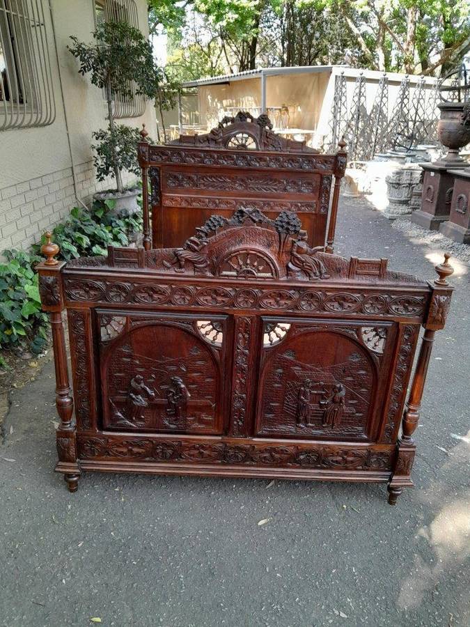 An Antique French Brittany Heavily Carved Oak Bed