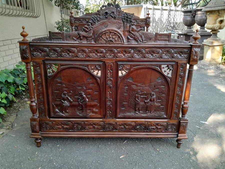 An Antique French Brittany Heavily Carved Oak Bed