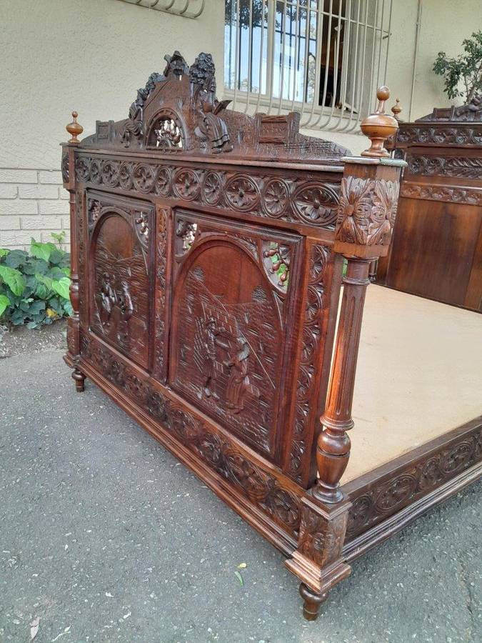 An Antique French Brittany Heavily Carved Oak Bed