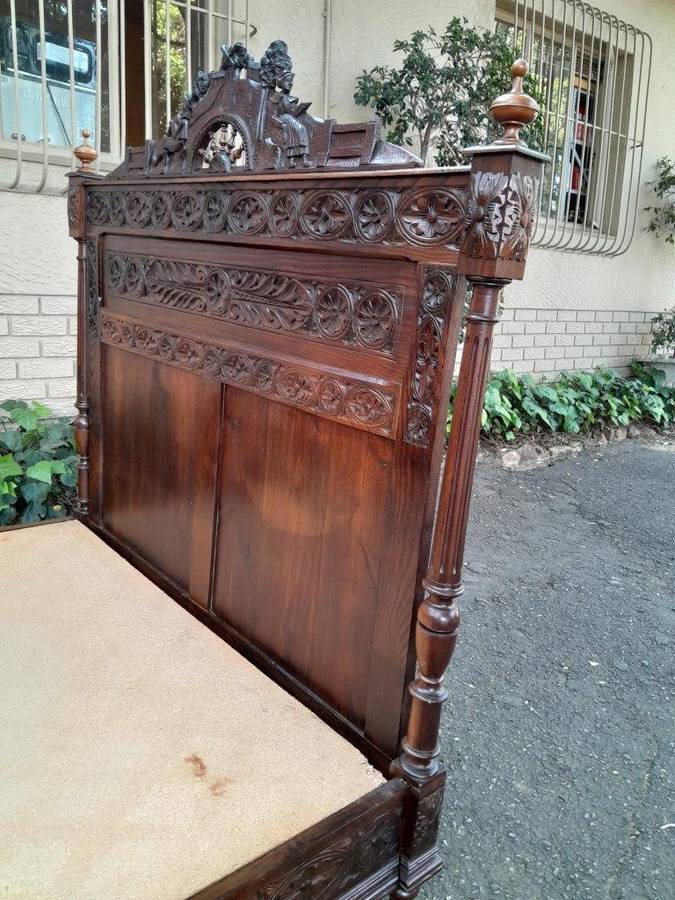 An Antique French Brittany Heavily Carved Oak Bed