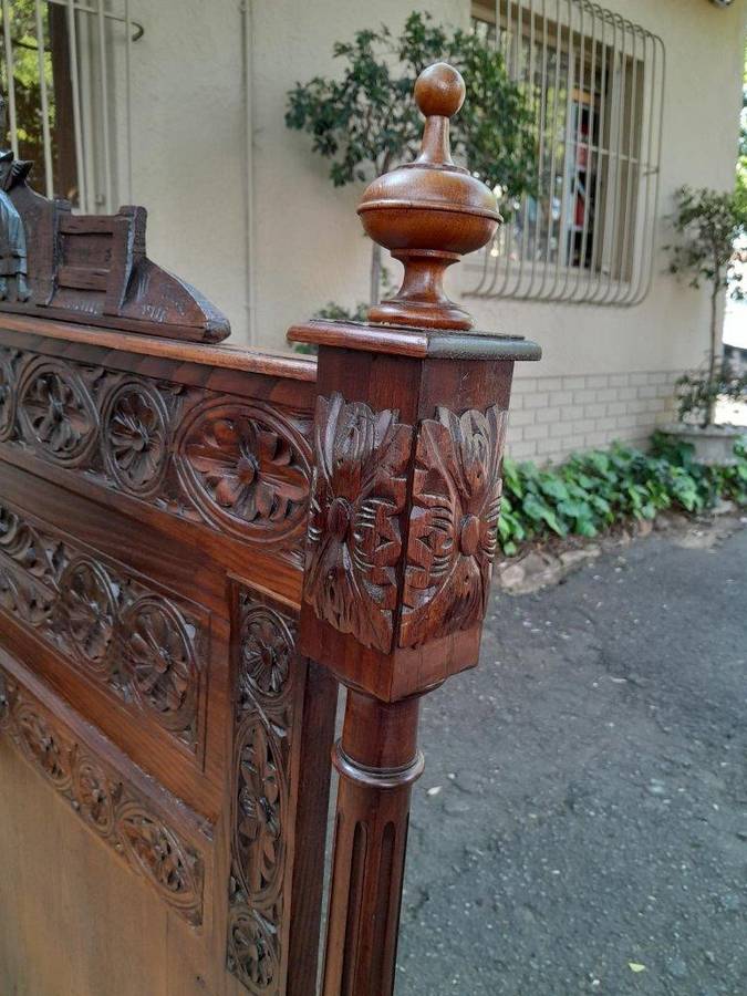 An Antique French Brittany Heavily Carved Oak Bed