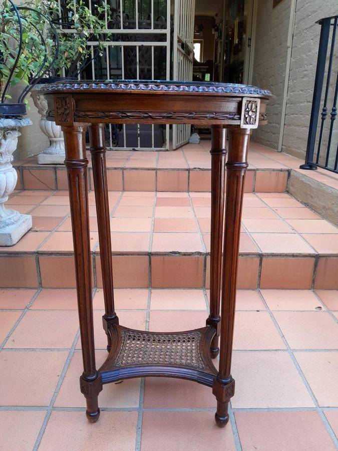 A French Style Gueridon Table With Marble Top And Rattan Shelf