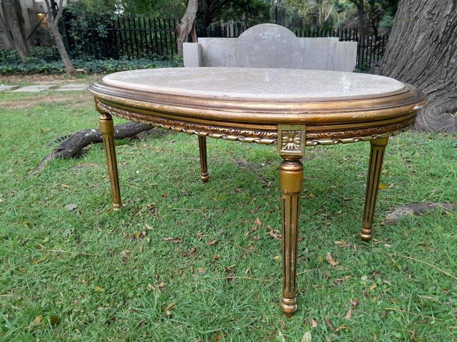 A French Style Oval Carved Giltwood Coffee Table With A Marble Top
