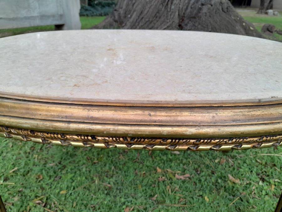 A French Style Oval Carved Giltwood Coffee Table With A Marble Top