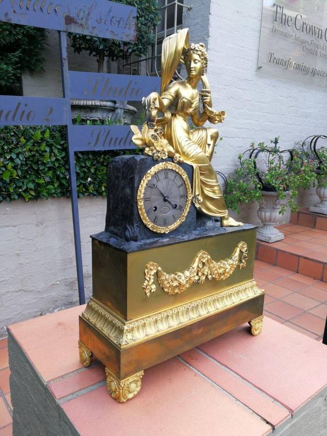 A Late 19th Century French Gilt And Bronze Clock With Pendulum