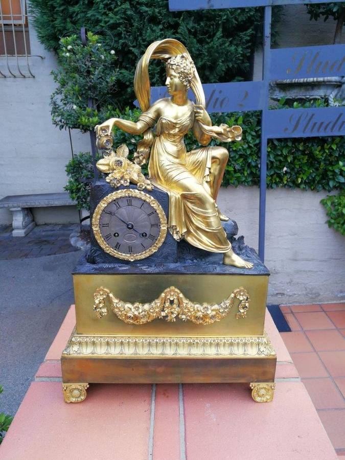A Late 19th Century French Gilt And Bronze Clock With Pendulum