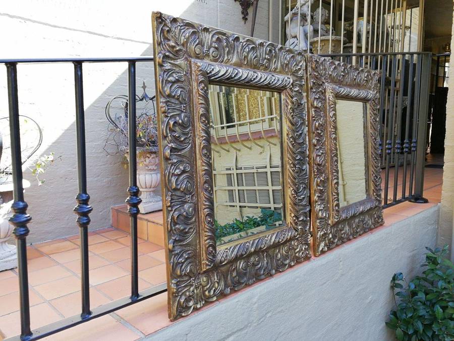 A Pair Of  20th Century Bevelled And Gilt-Painted Wooden Mirrors