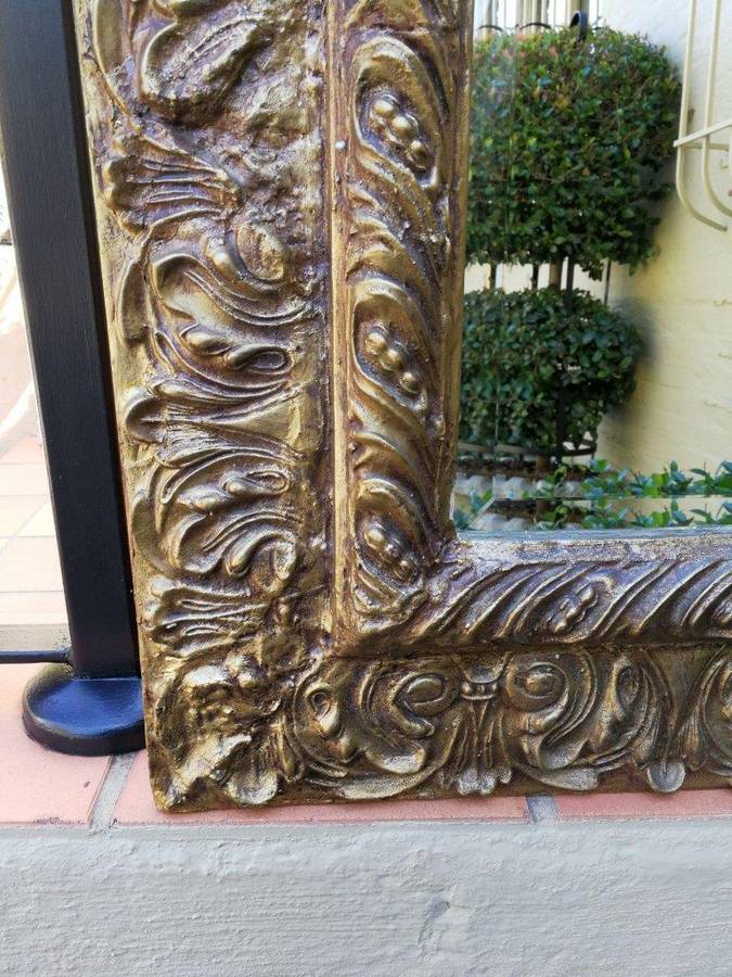 A Pair Of  20th Century Bevelled And Gilt-Painted Wooden Mirrors