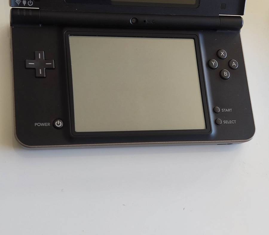 Nintendo Dsi Xl console with original charger