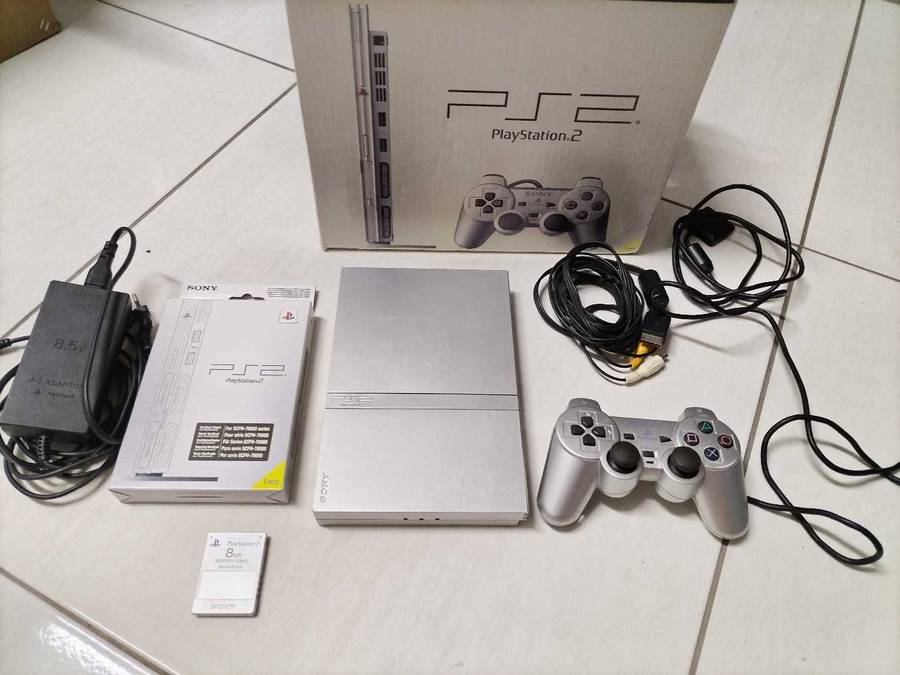 Boxed silver Playstation 2 slim