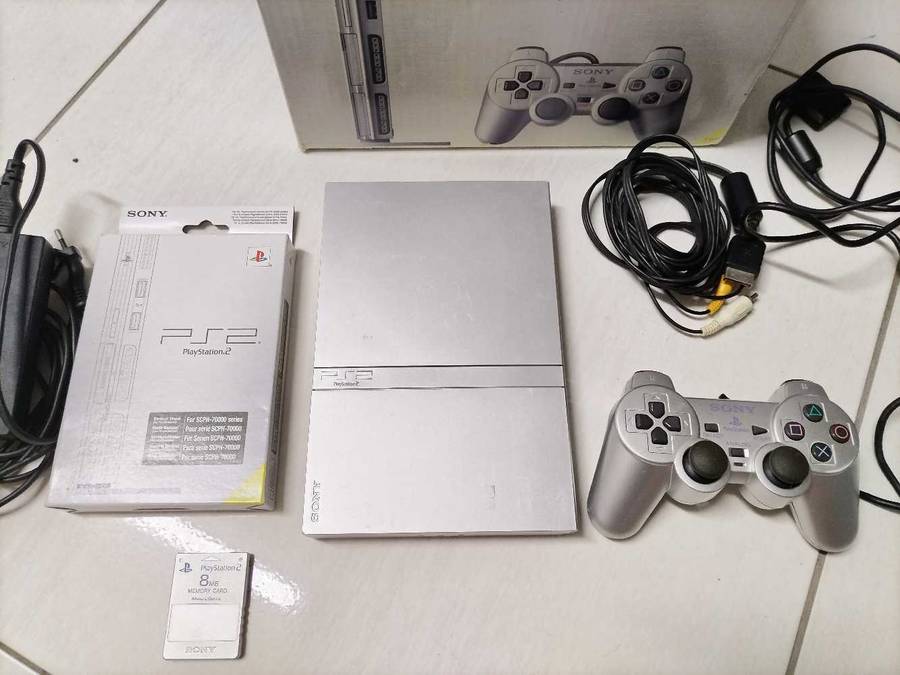 Boxed silver Playstation 2 slim