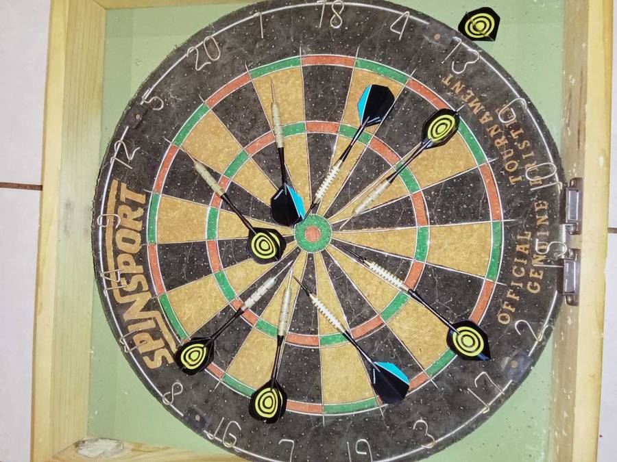 Dartboard in wooden case with darts