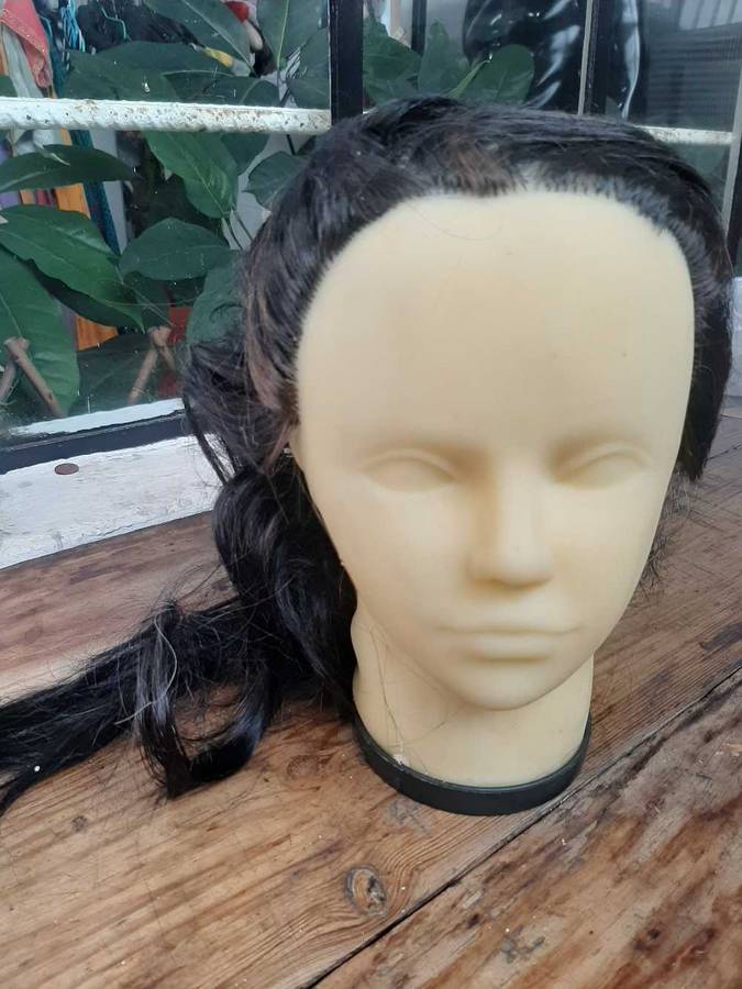 Display head mannequins with attached hair