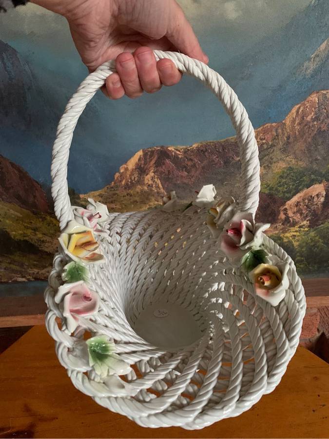Huge woven pottery basket decorated with roses