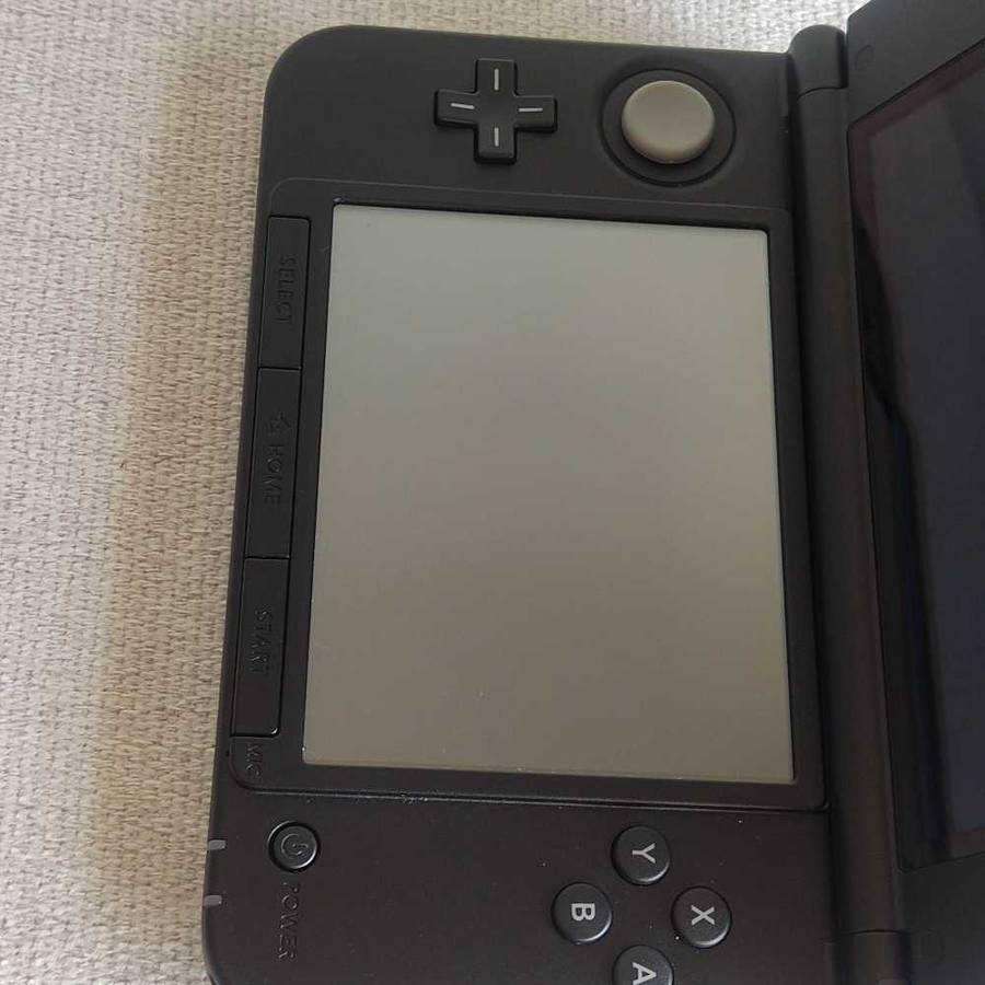 Nintendo 3ds XL console with original charger