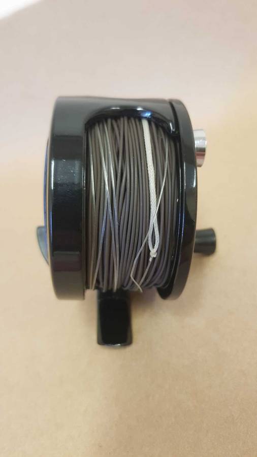 Explorer fly reel loaded with backing, fly line and tippett.