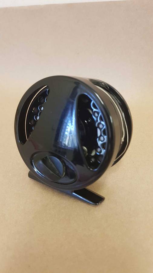 Explorer fly reel loaded with backing, fly line and tippett.