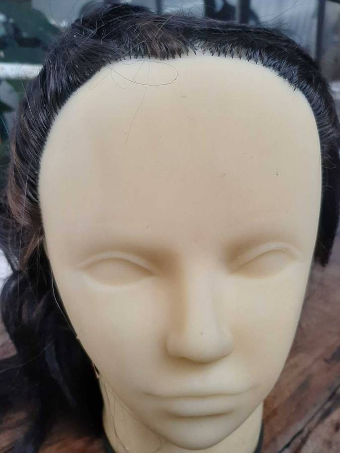 Display head mannequins with attached hair