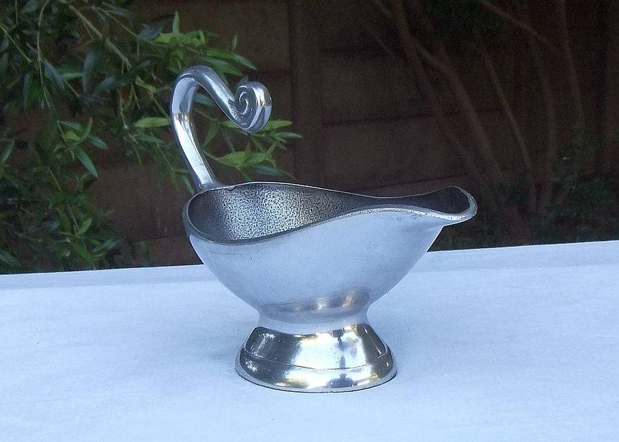 A STUNNING CARROL BOYES STYLE METAL SAUCE OR GRAVY BOAT