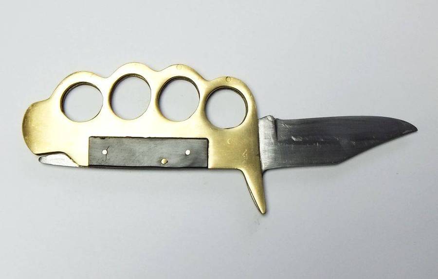 A rarely seen vintage brass knuckle duster knife combo in great working condition
